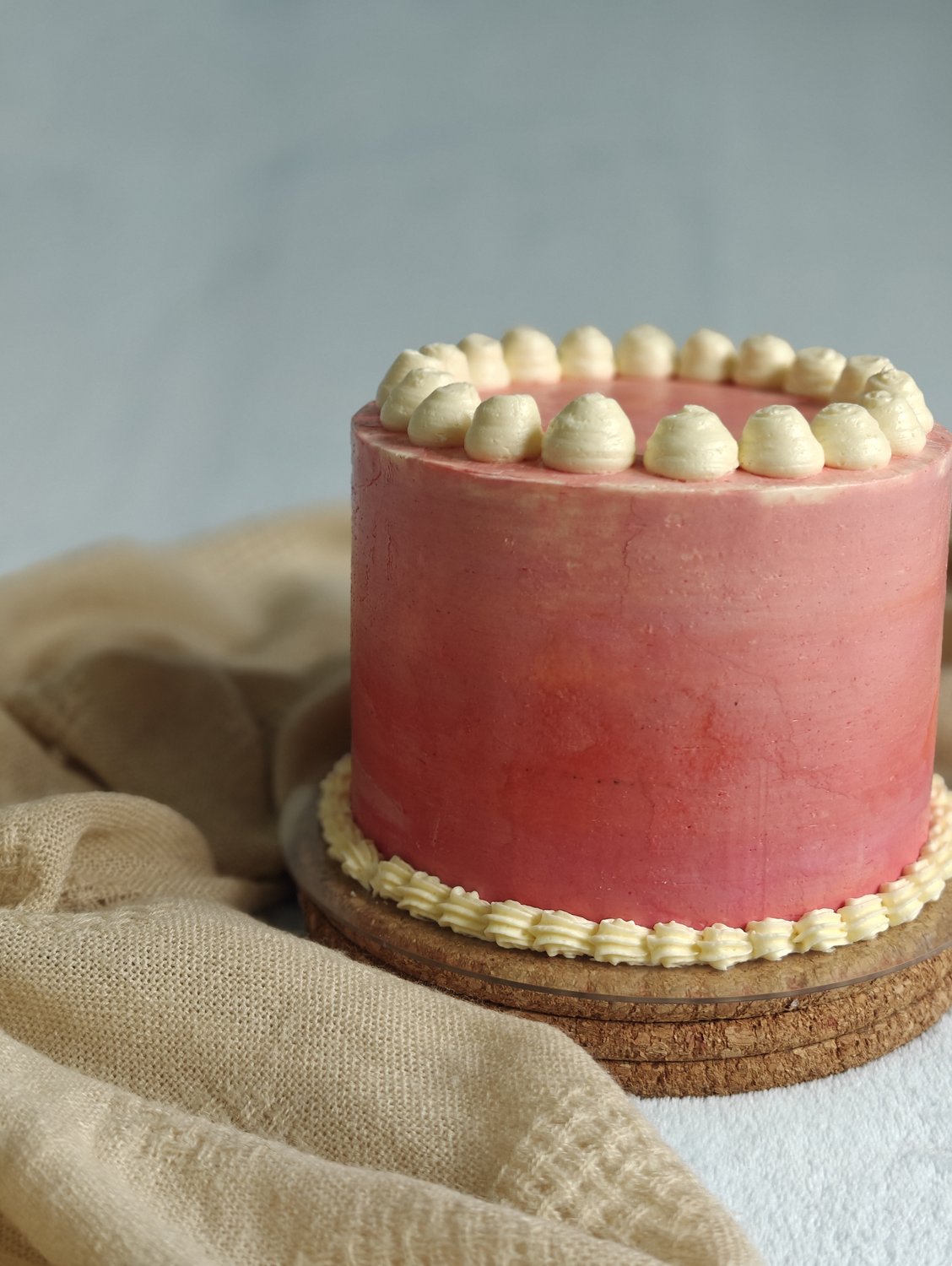 Dusty rose cake with cream pearl piping